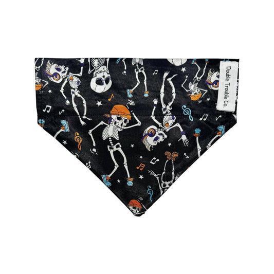 Dog bandana with skeletons and music notes on a black background