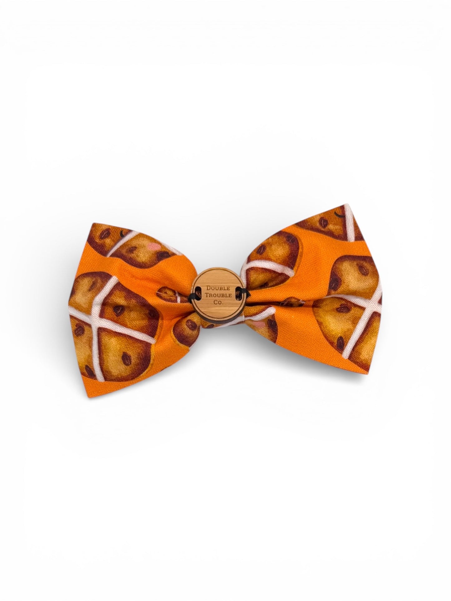 Easter Hot cross buns Orange bow tie with a pattern on a white background